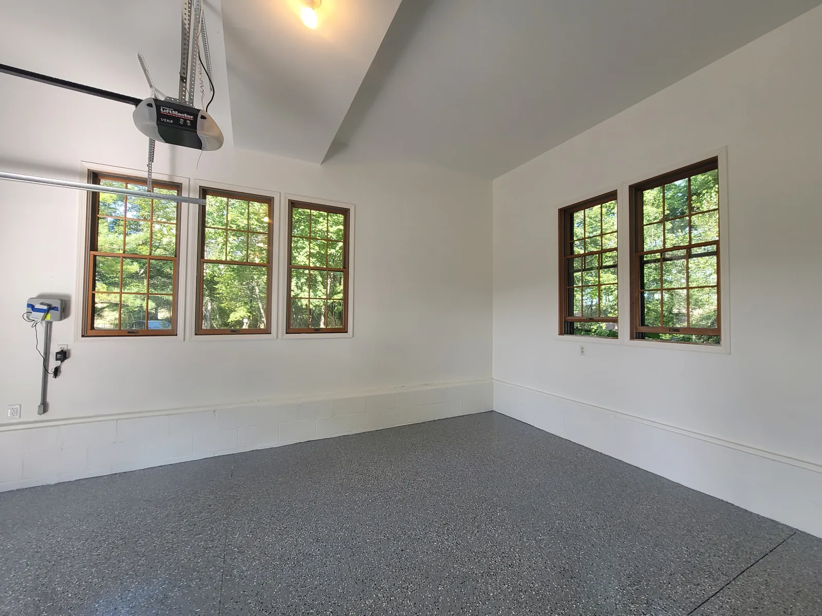 Professional epoxy garage floor coating with decorative chip finish